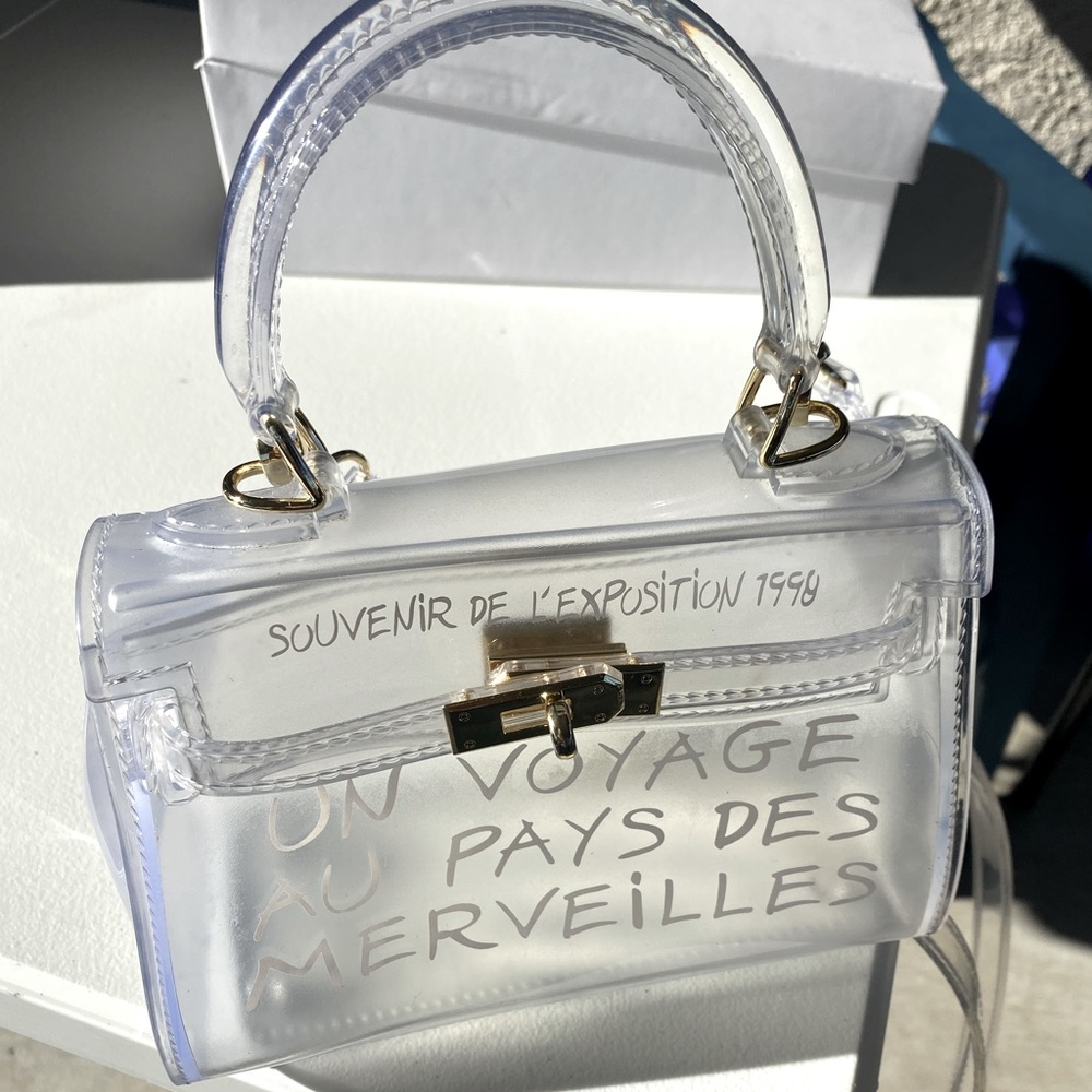 Clear Un Voyage hand bag